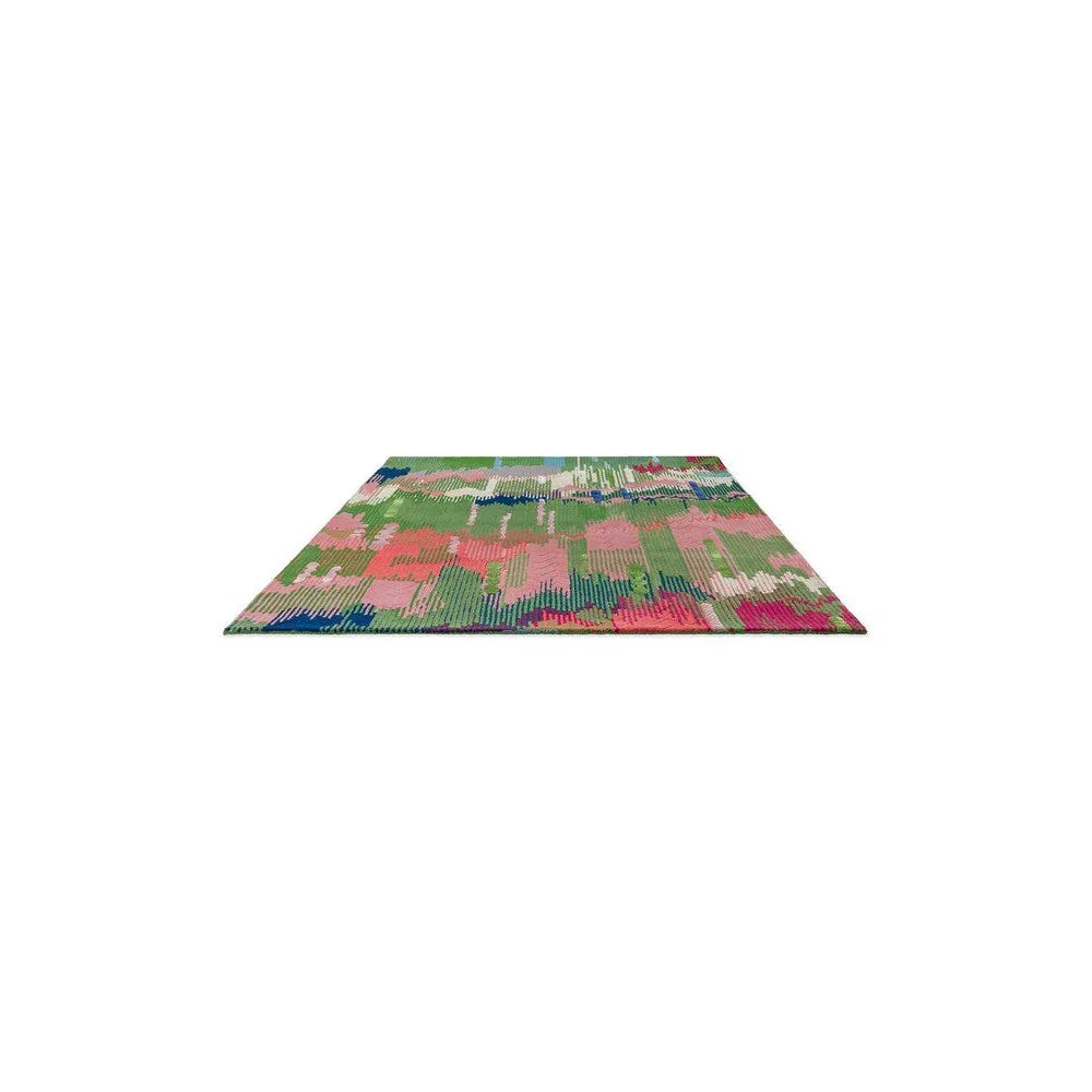 Sophie Robinson x Harlequin Wilderness Designer Rug featuring abstract patchwork in peridot, emerald, pink on white background, hand-tufted wool
