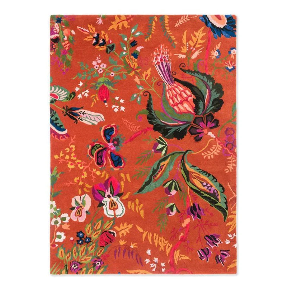 Sophie Robinson x Harlequin Wonderland Floral Rug featuring botanical pattern in amber, navy, pink on orange background, hand-tufted wool