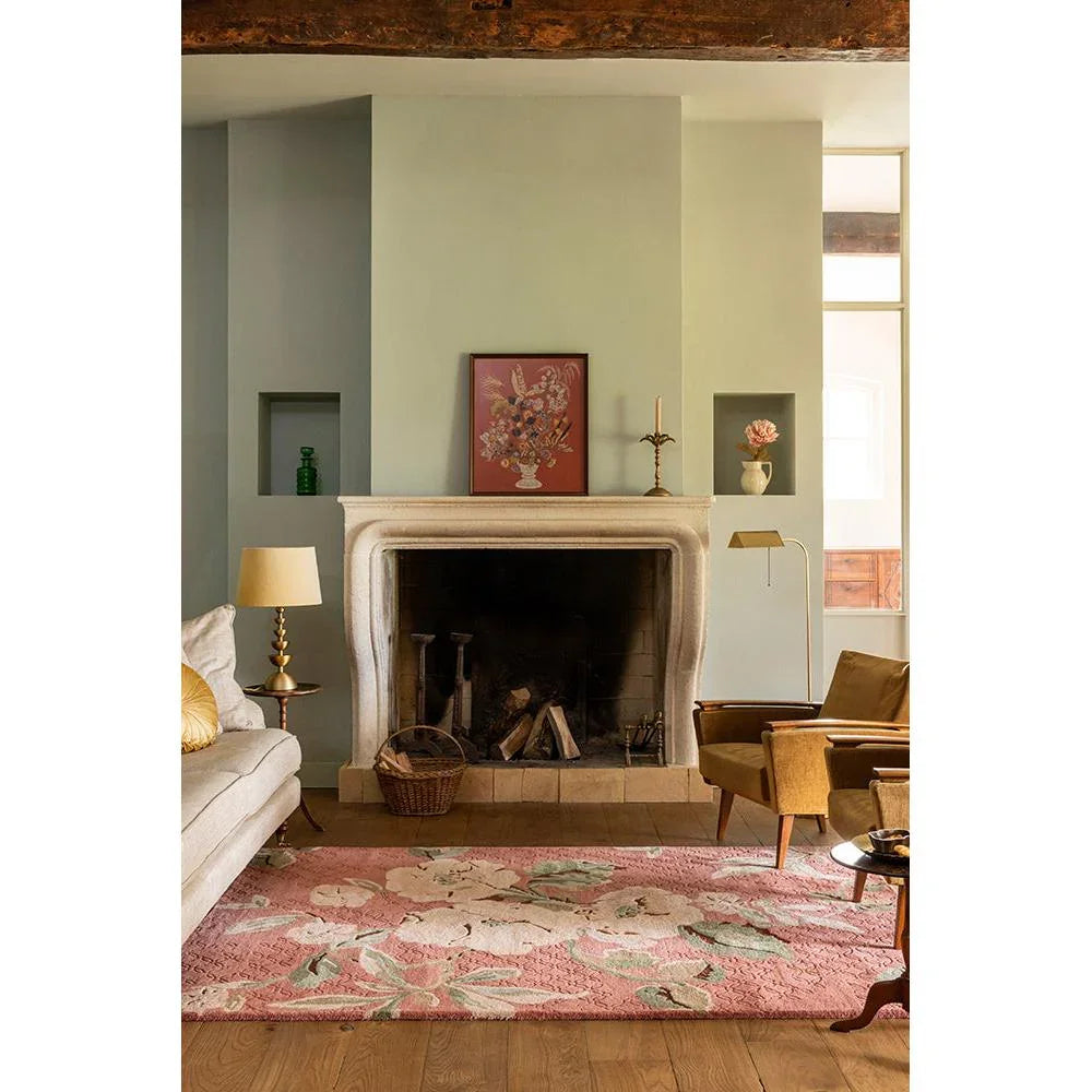 Laura Ashley Aylworth Trail Rug featuring botanical floral pattern in terracotta orange, pink, cream on pink background, hand-tufted wool