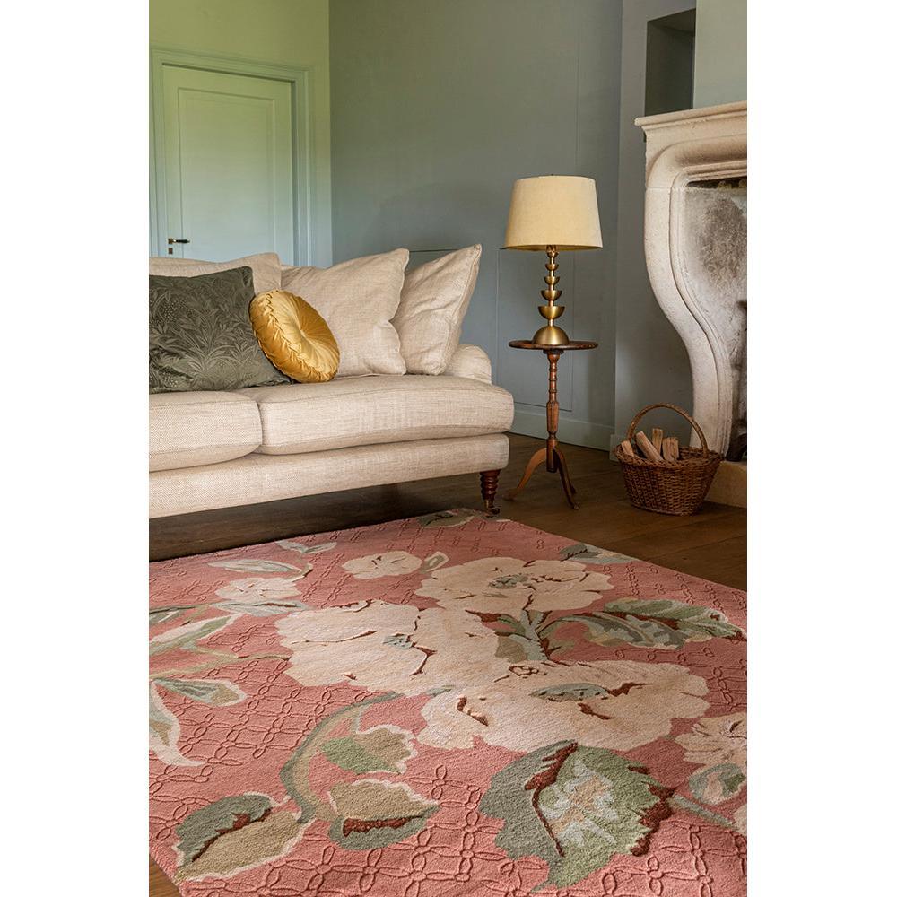 Laura Ashley Aylworth Trail Terracotta Rug featuring floral motif in terracotta, blush pink, sage green on soft pink background, hand-tufted wool