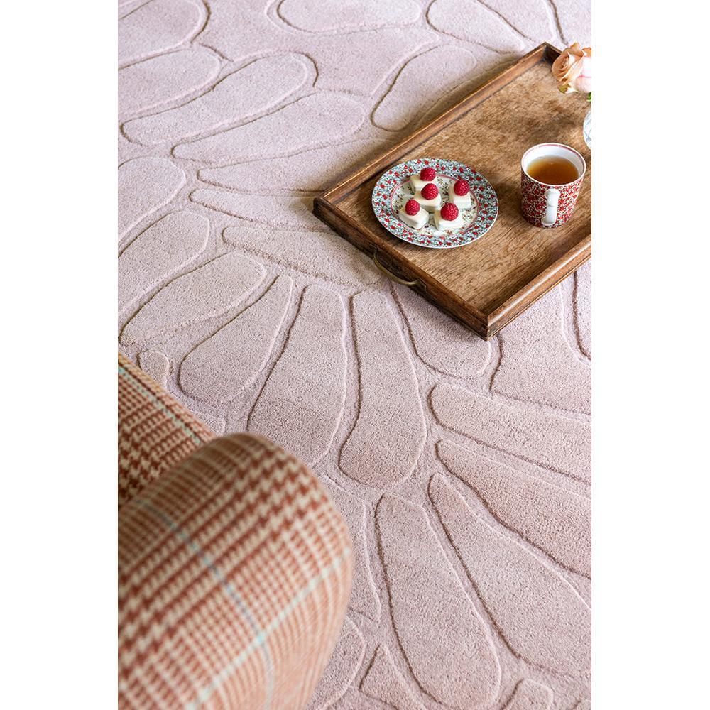 Laura Ashley Coleby Petals Chalk Pink Designer Rug featuring petal pattern in chalk pink on soft pink background, hand-tufted wool