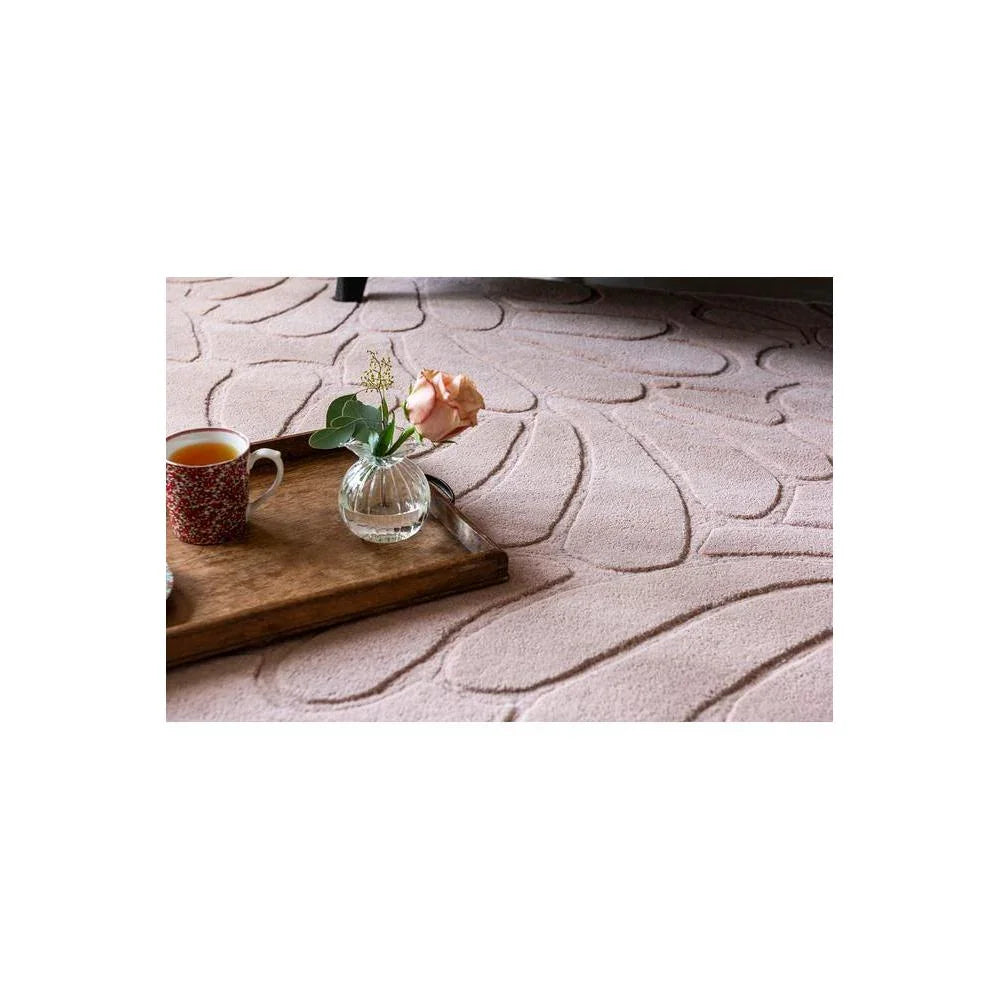 Laura Ashley Coleby Petals Chalk Pink Designer Rug featuring petal pattern in blush pink on chalk background