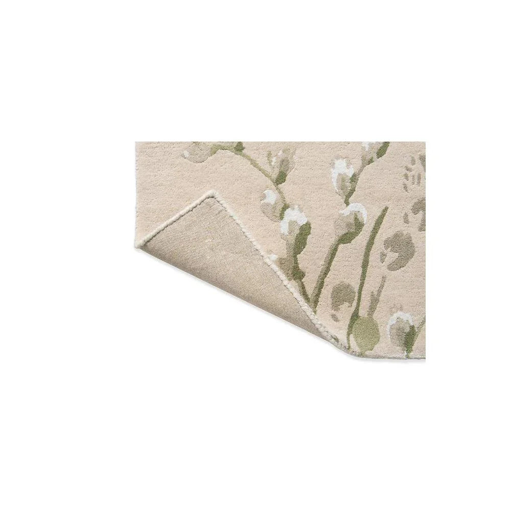 Laura Ashley Pussy Willow Hedgerow Green Rug featuring botanical pattern in cream and sage-green on beige, hand-tufted wool