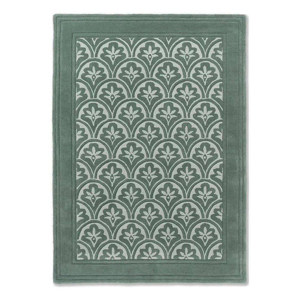 Laura Ashley Catarina Fern Designer Rug featuring scalloped arch fern motif in sage-green and mint on teal border, machine-woven polyester