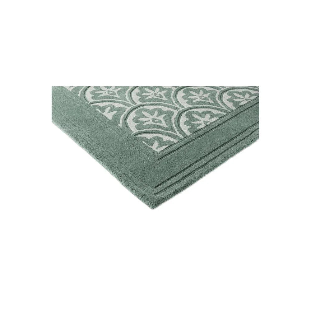 Laura Ashley Catarina Fern Designer Rug featuring botanical fern pattern in cream on teal background, hand-tufted wool