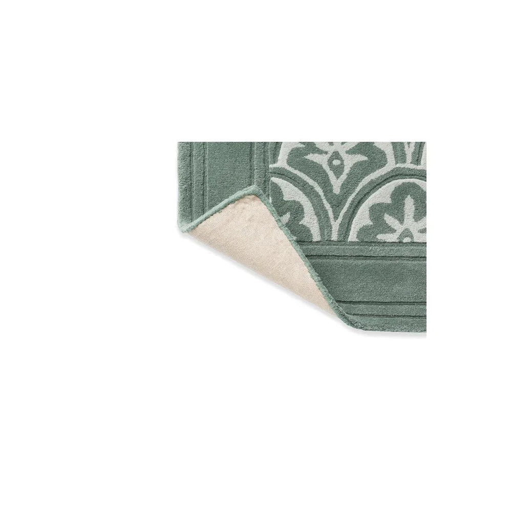 Laura Ashley Catarina Fern Designer Rug featuring botanical fern pattern in sage green, teal and cream on pale background, hand-tufted wool