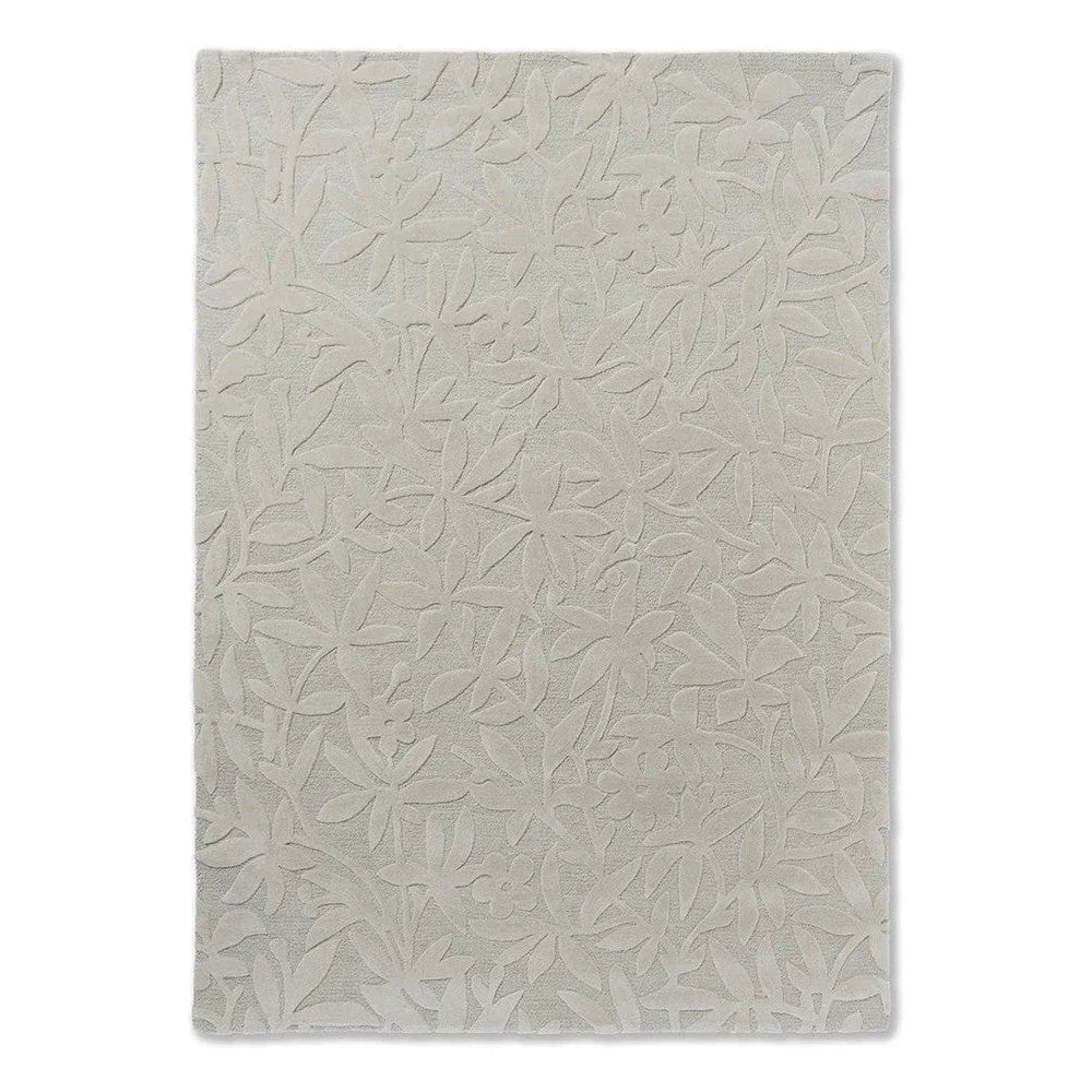 Laura Ashley Cleavers Natural Designer Rug featuring embossed botanical leaf pattern in ivory and beige on cream background, machine-made wool blend