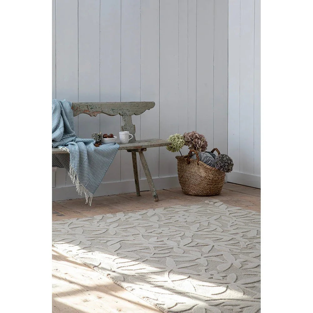Laura Ashley Cleavers Natural Designer Rug featuring leaf pattern in cream, taupe and beige on ivory background, hand-tufted wool