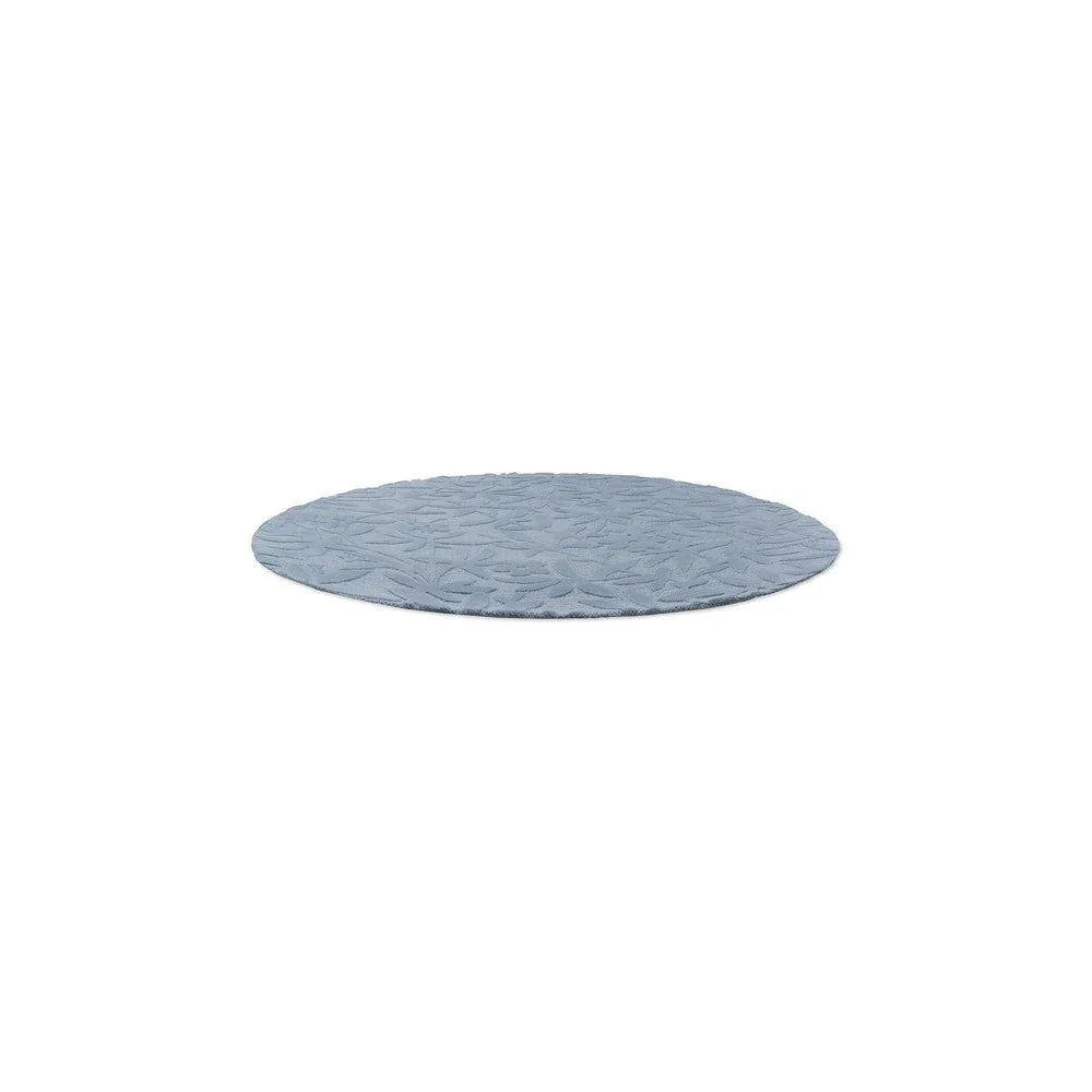 Laura Ashley Cleavers Seaspray Round Rug featuring subtle leaf pattern in seaspray blue and powder blue on white, machine-made polyester