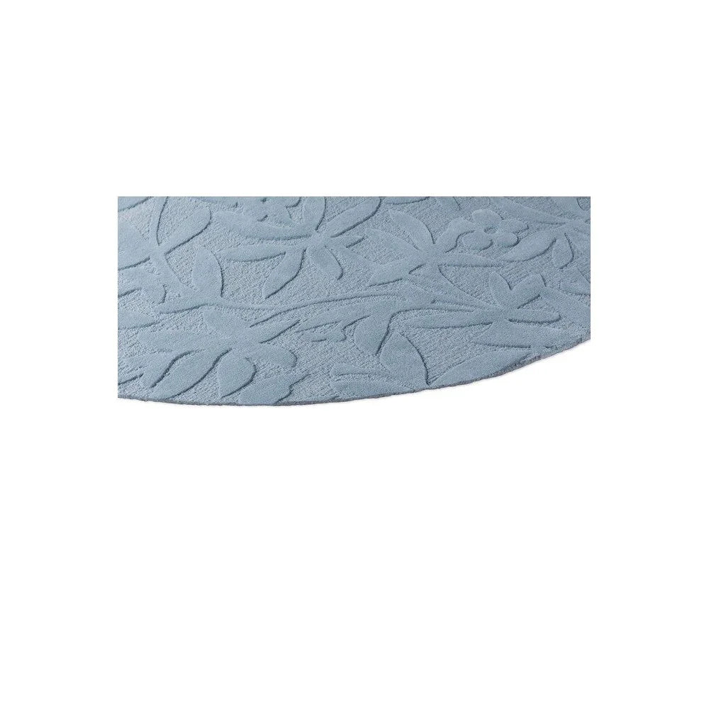 Laura Ashley Cleavers Seaspray Round Rug featuring embossed leaf pattern in seaspray blue on white background, hand-tufted wool