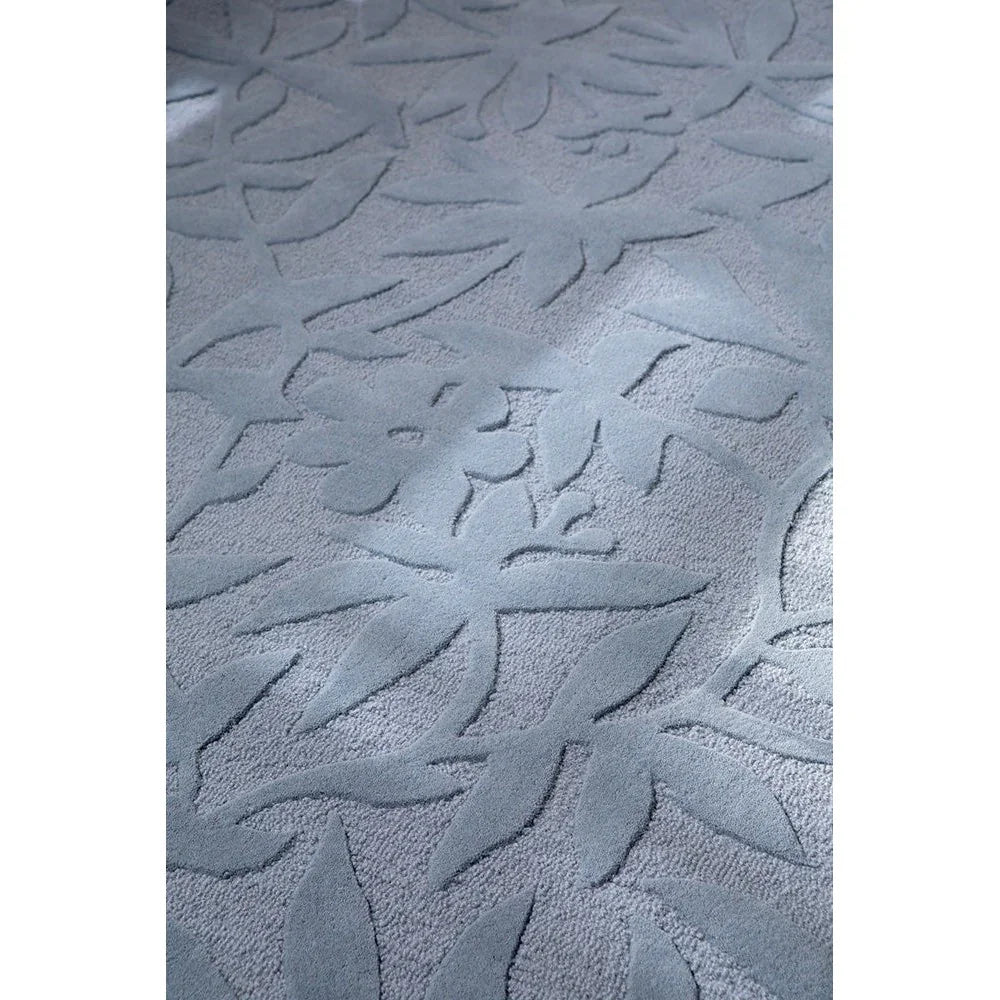 Laura Ashley Cleavers Seaspray Designer Rug featuring abstract wave pattern in seaspray blue on light blue background, machine-woven wool