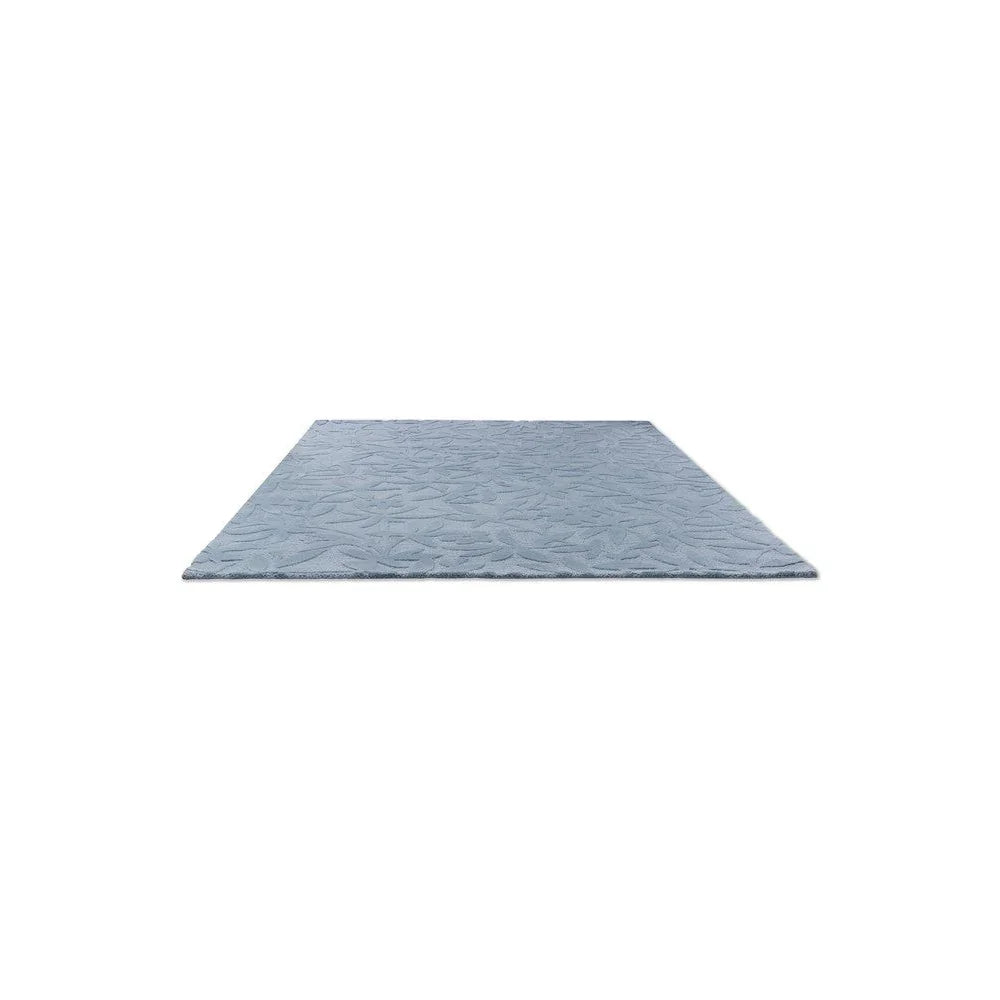 Laura Ashley Cleavers Seaspray Designer Rug featuring wave pattern in seaspray blue and pale grey on light blue background, hand-tufted wool