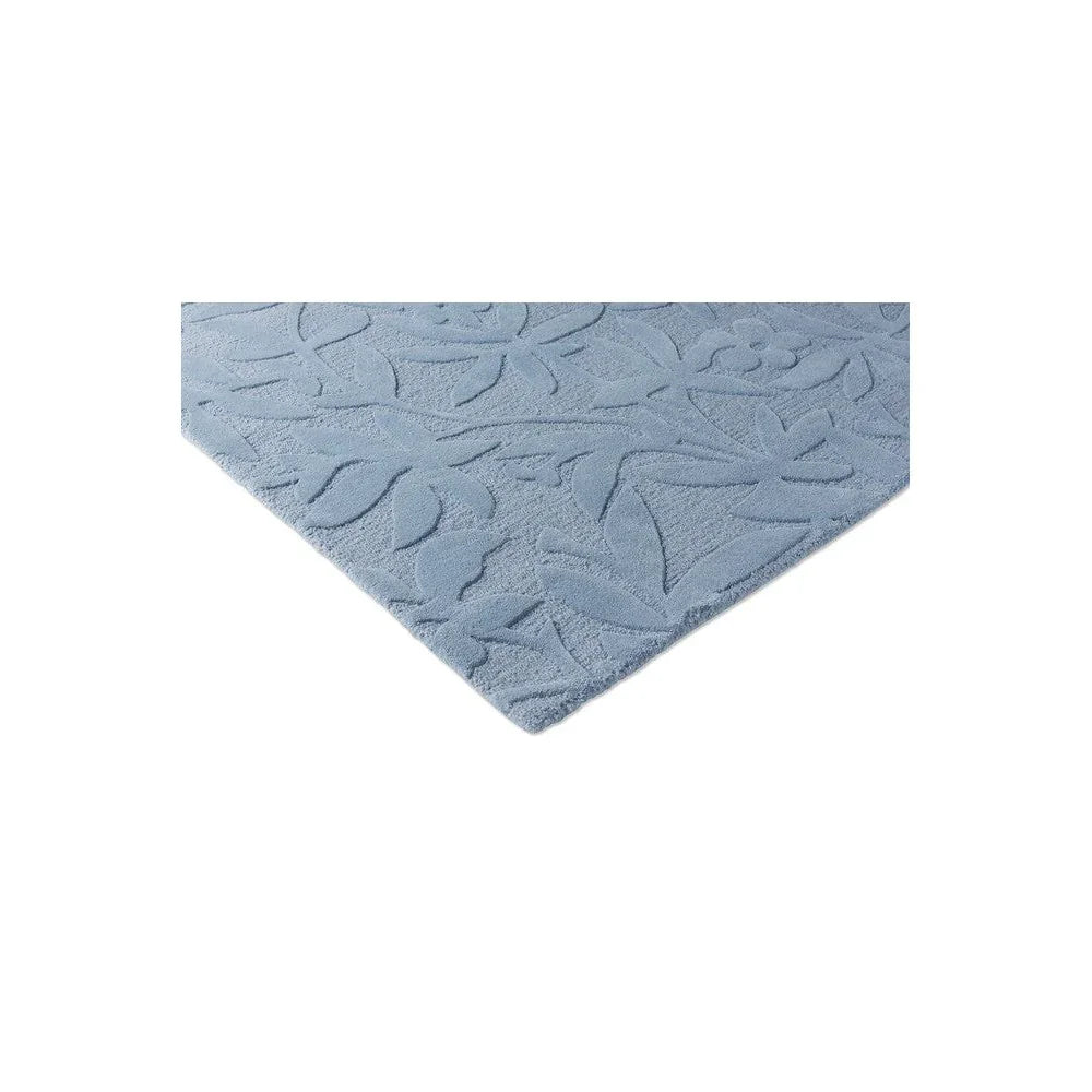 Laura Ashley Cleavers Seaspray Designer Rug featuring embossed leaf pattern in light blue on pale blue background, machine-woven
