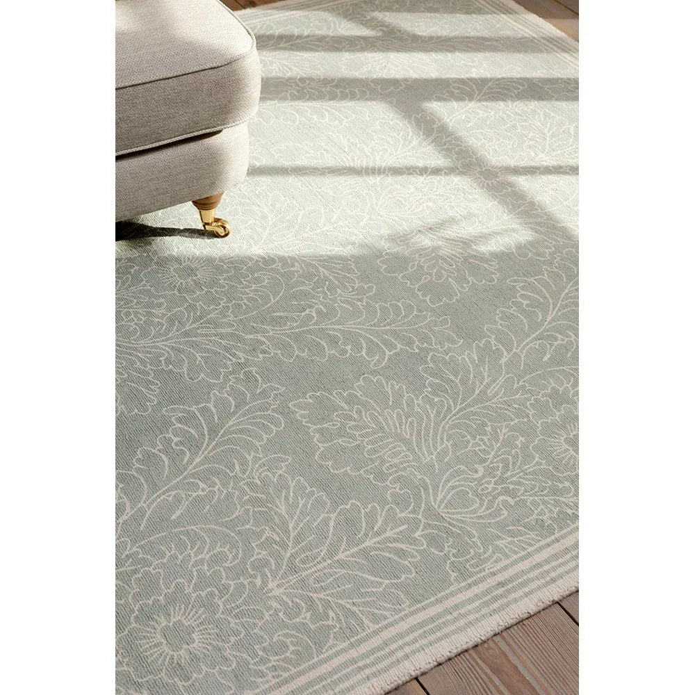 Laura Ashley Silchester Pale Sage Rug featuring damask floral pattern in ivory and cream on pale sage background, machine-made polyester blend