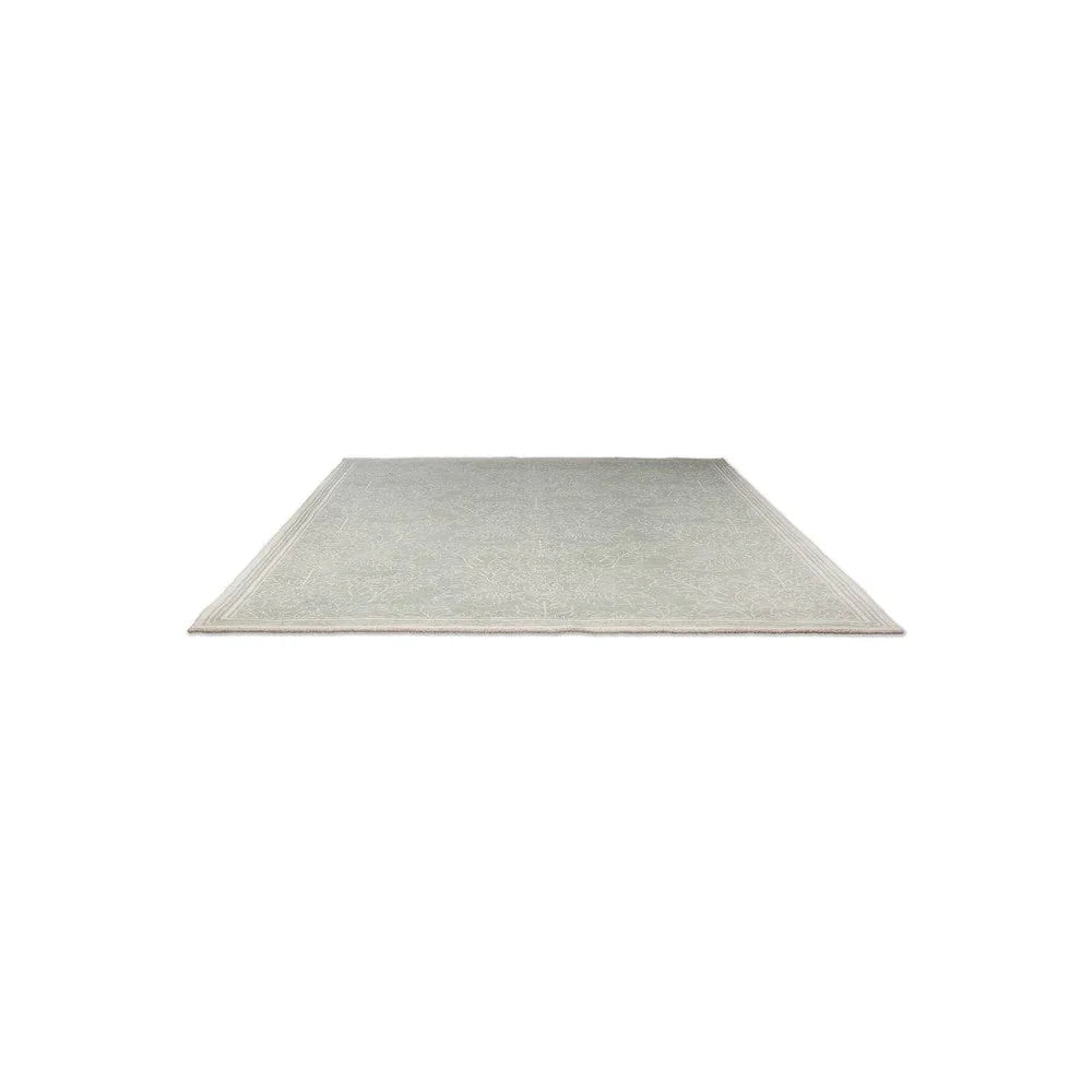 Laura Ashley Silchester Pale Sage Rug featuring subtle border in sage, cream and grey on pale background, machine-woven wool blend