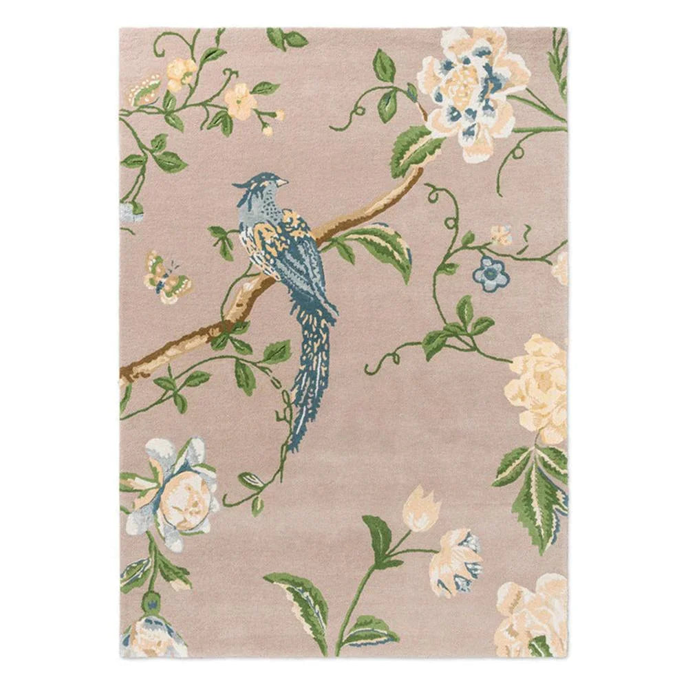 Laura Ashley Summer Palace Truffle Seaspray Rug featuring bird and floral motif in navy blue, cream, sage green on pale pink-beige, hand-tufted wool