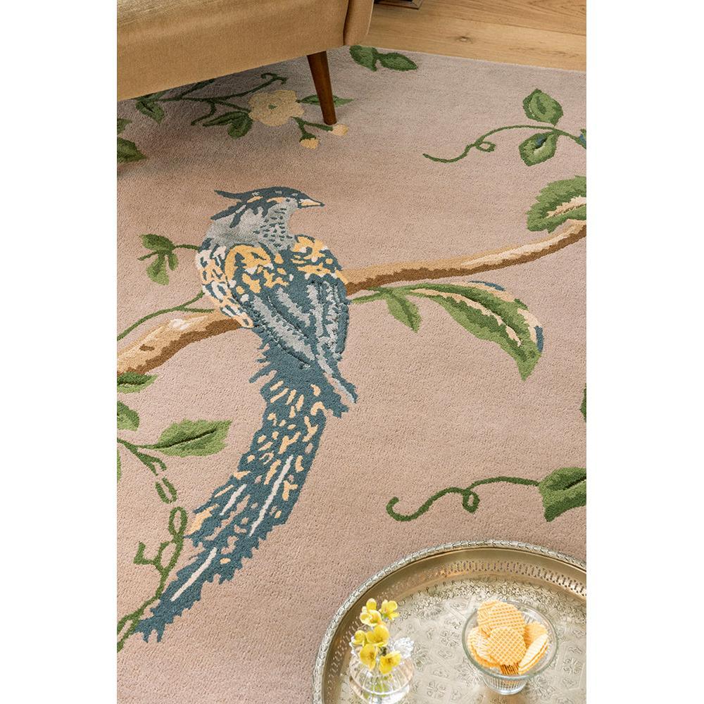 Laura Ashley Summer Palace Truffle Seaspray Rug featuring bird-on-branch motif in navy blue, teal and sage green on pale pink background, machine-woven
