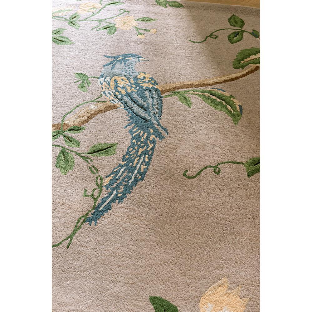Laura Ashley Summer Palace Truffle - Seaspray Designer Rug featuring a perched blue bird on a branch in blue, teal, sage-green on warm beige background, hand-tufted wool