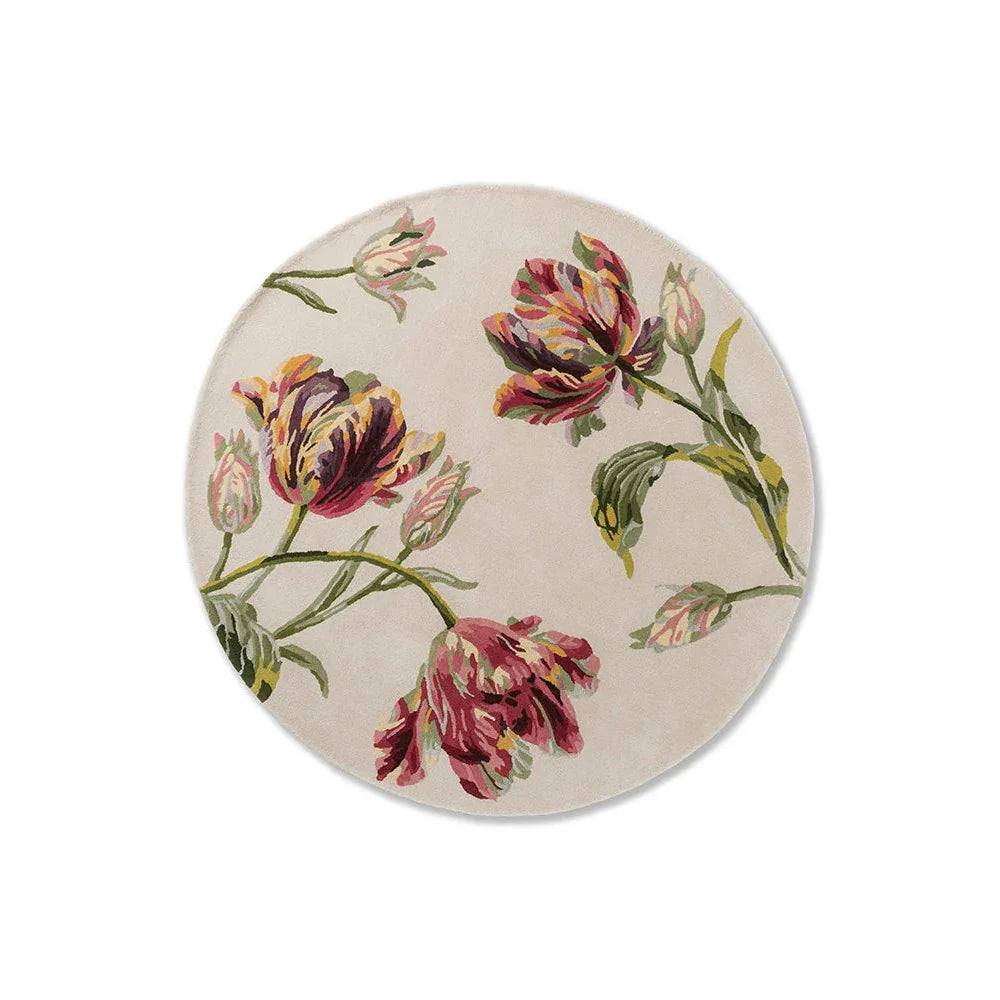 Laura Ashley Gosford Cranberry Round Rug featuring botanical tulip pattern in cranberry, pink, purple and green on beige background