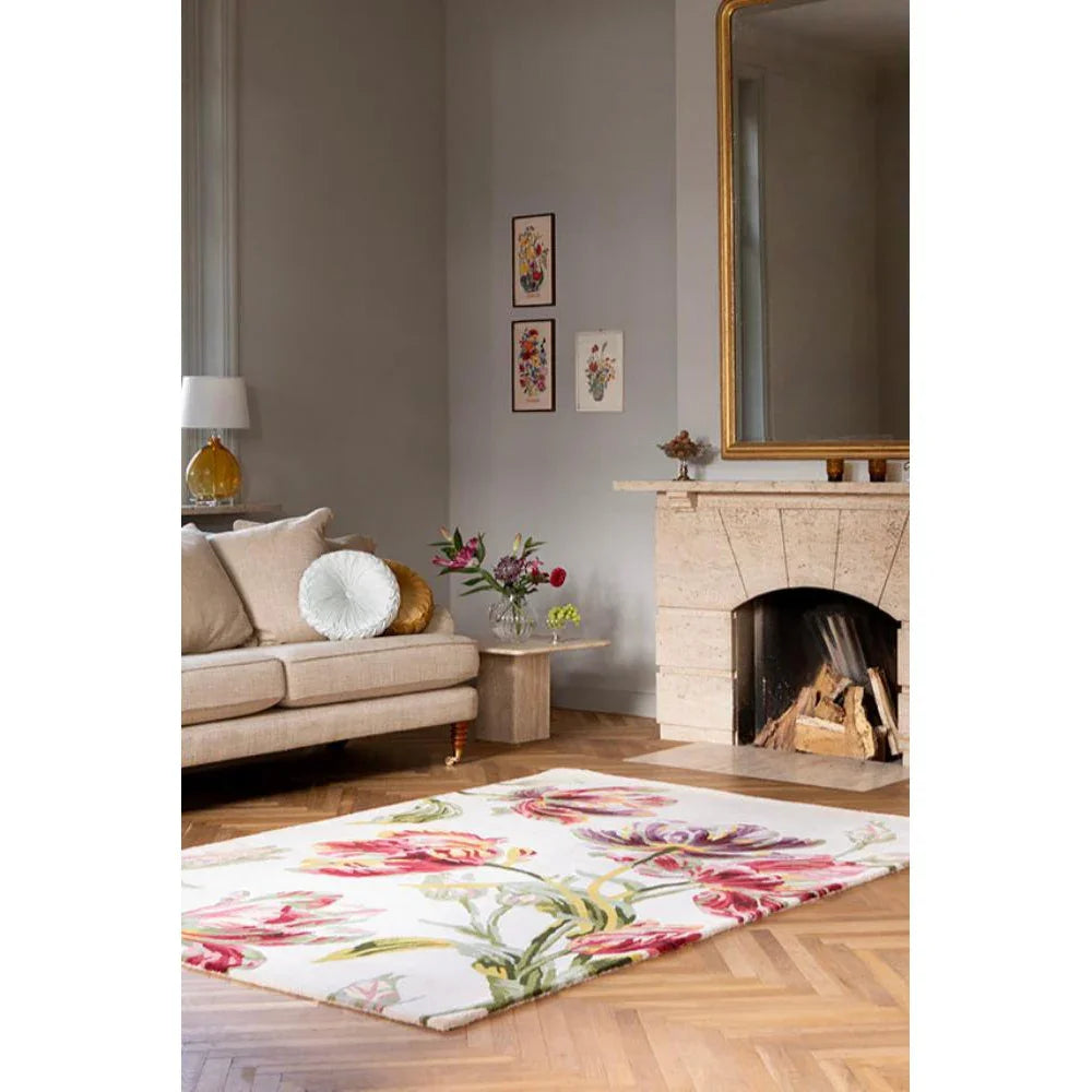 Laura Ashley Gosford Cranberry Designer Rug featuring bold floral pattern in cranberry pink, green on white background, hand-tufted wool