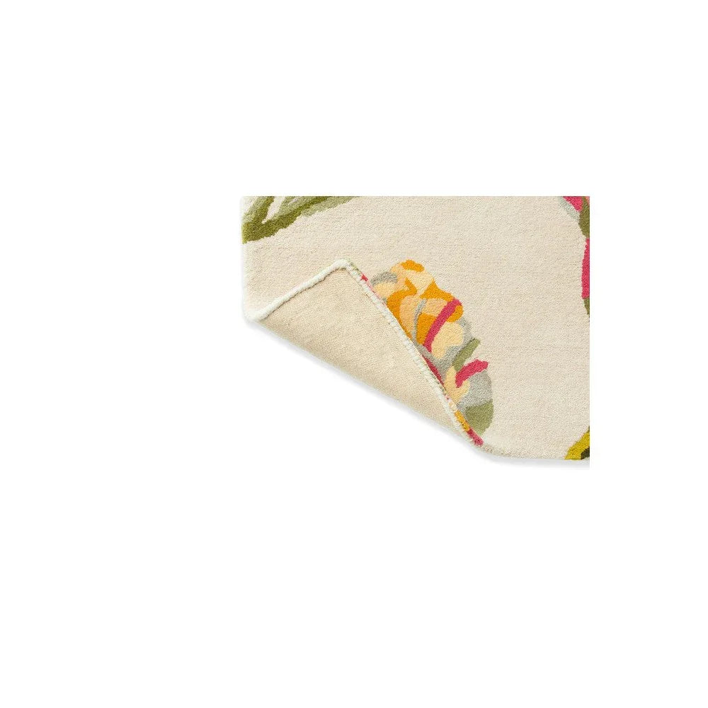 Laura Ashley Gosford Cranberry Rug featuring bold floral pattern in cream with pink, yellow and green, hand-tufted wool