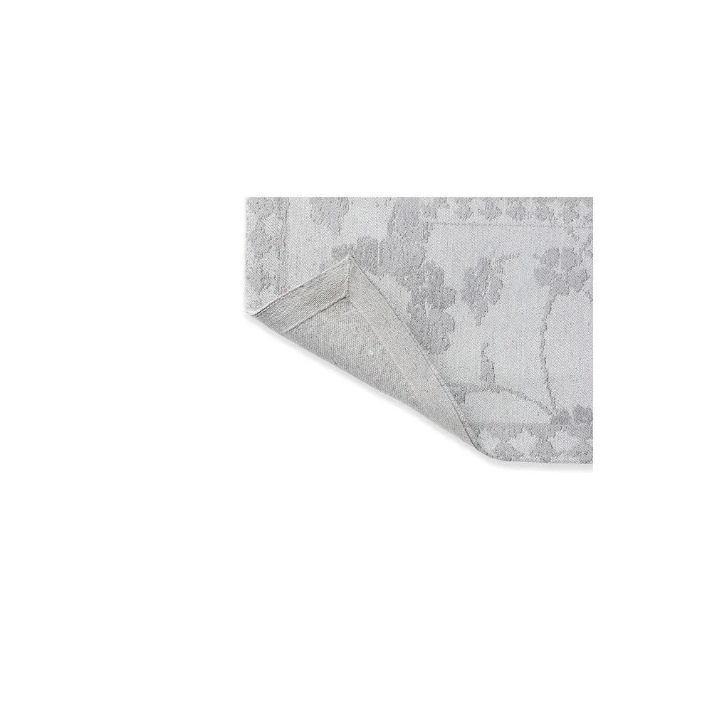 Laura Ashley Newborough Steel Designer Rug featuring subtle damask pattern in steel grey and silver on pale grey, machine-woven wool blend