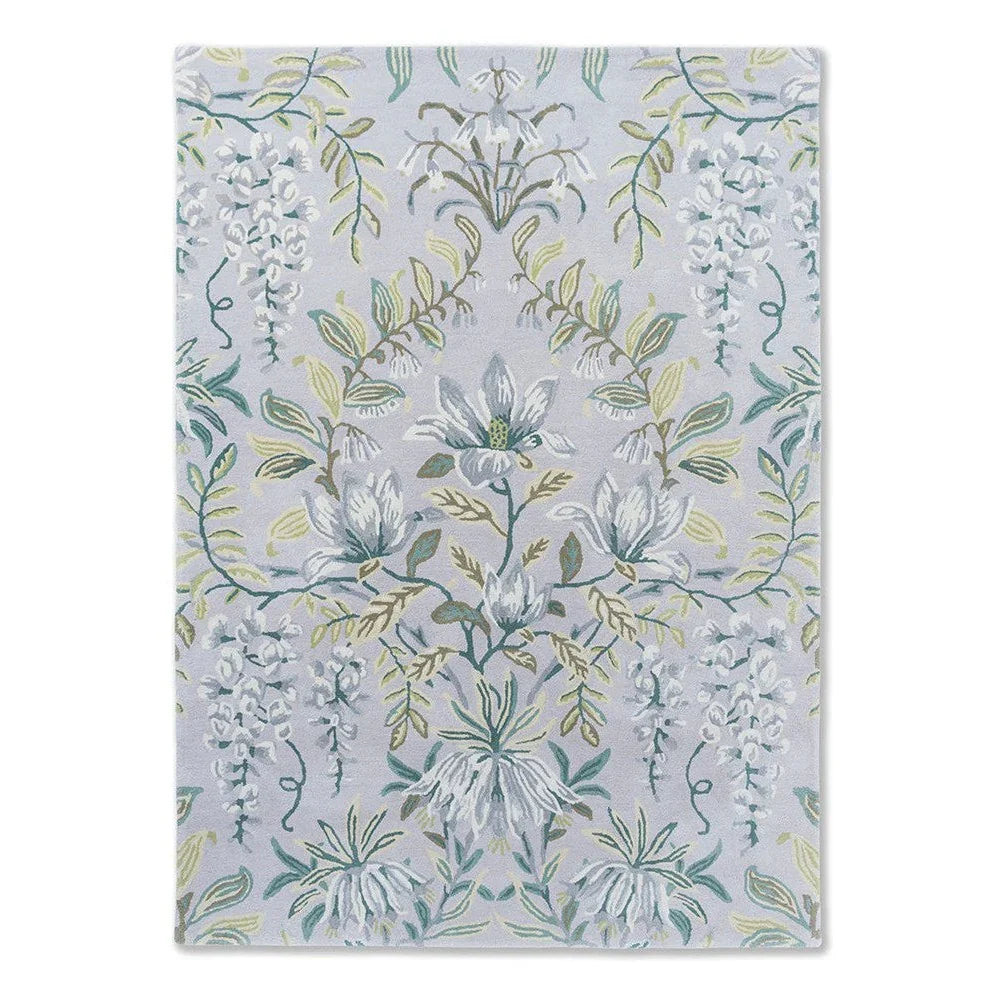 Laura Ashley Parterre Sage Rug featuring botanical floral pattern in sage green, blue and cream on light lilac background, hand-tufted wool