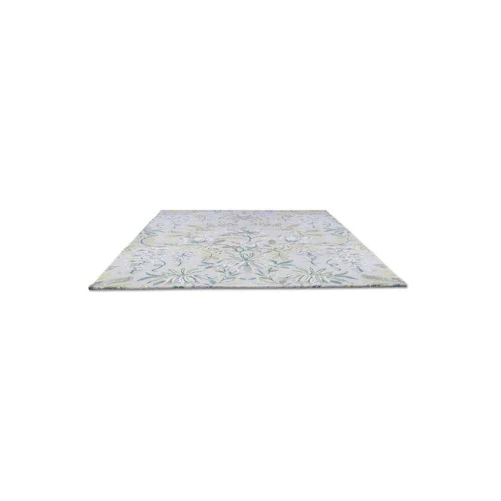 Laura Ashley Parterre Sage Rug featuring botanical floral pattern in sage green, pale blue and ivory on light cream background, hand-tufted wool