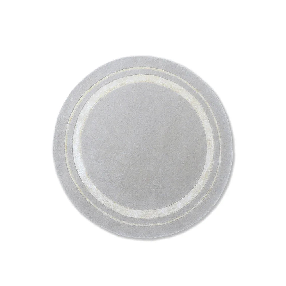 Laura Ashley Redbrook Silver Designer Rug featuring concentric rings in silver and ivory on pale grey, power-loomed wool blend
