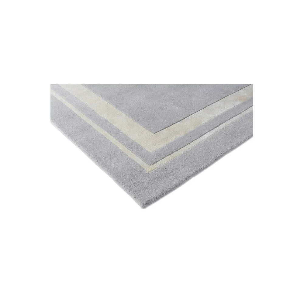 Laura Ashley Redbrook Silver Designer Rug featuring geometric chevron border in cream and ivory on silver-grey background, machine-woven polyester