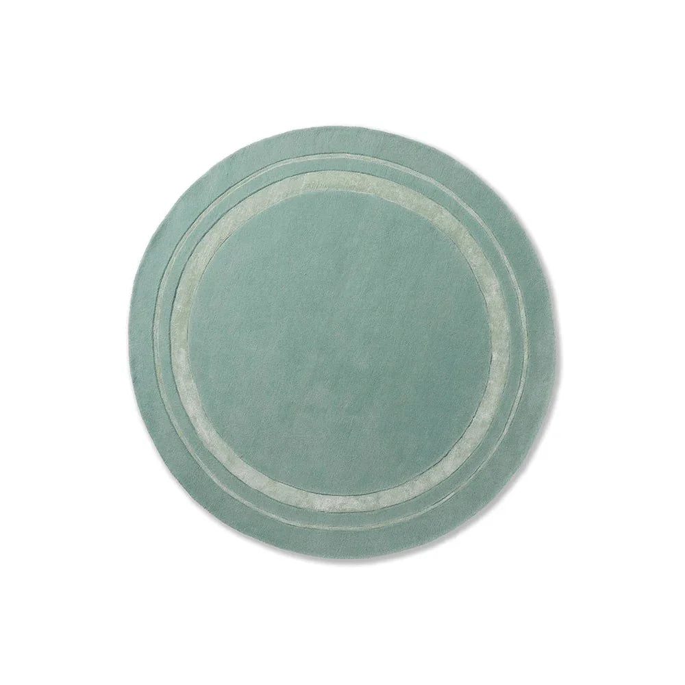Laura Ashley Redbrook Duck Egg Designer Rug featuring circular ring pattern in duck-egg green on pale background, hand-tufted wool