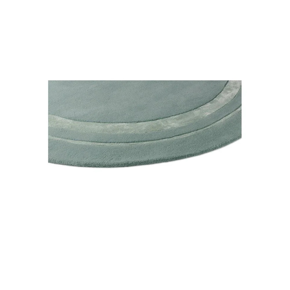 Laura Ashley Redbrook Duck Egg Round Rug featuring concentric curved bands in duck egg, cream and sage on duck egg background, machine-woven wool