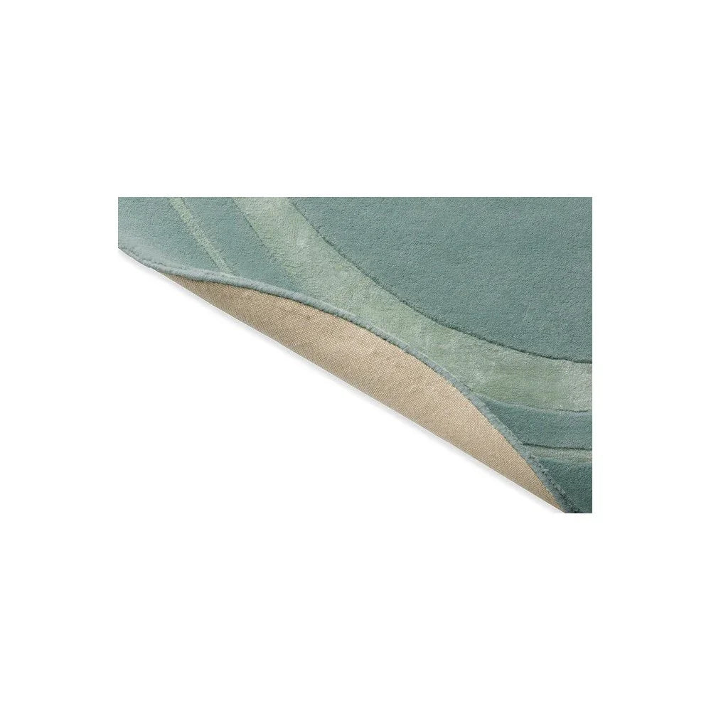 Laura Ashley Redbrook Duck Egg rug featuring abstract curved pattern in duck egg, sage green and beige on cream background, hand-tufted wool