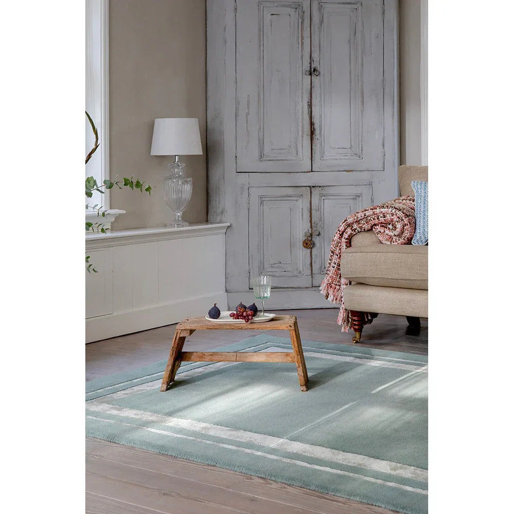 Laura Ashley Redbrook Duck Egg Designer Rug featuring striped pattern in duck egg and white on cream background, hand-tufted wool