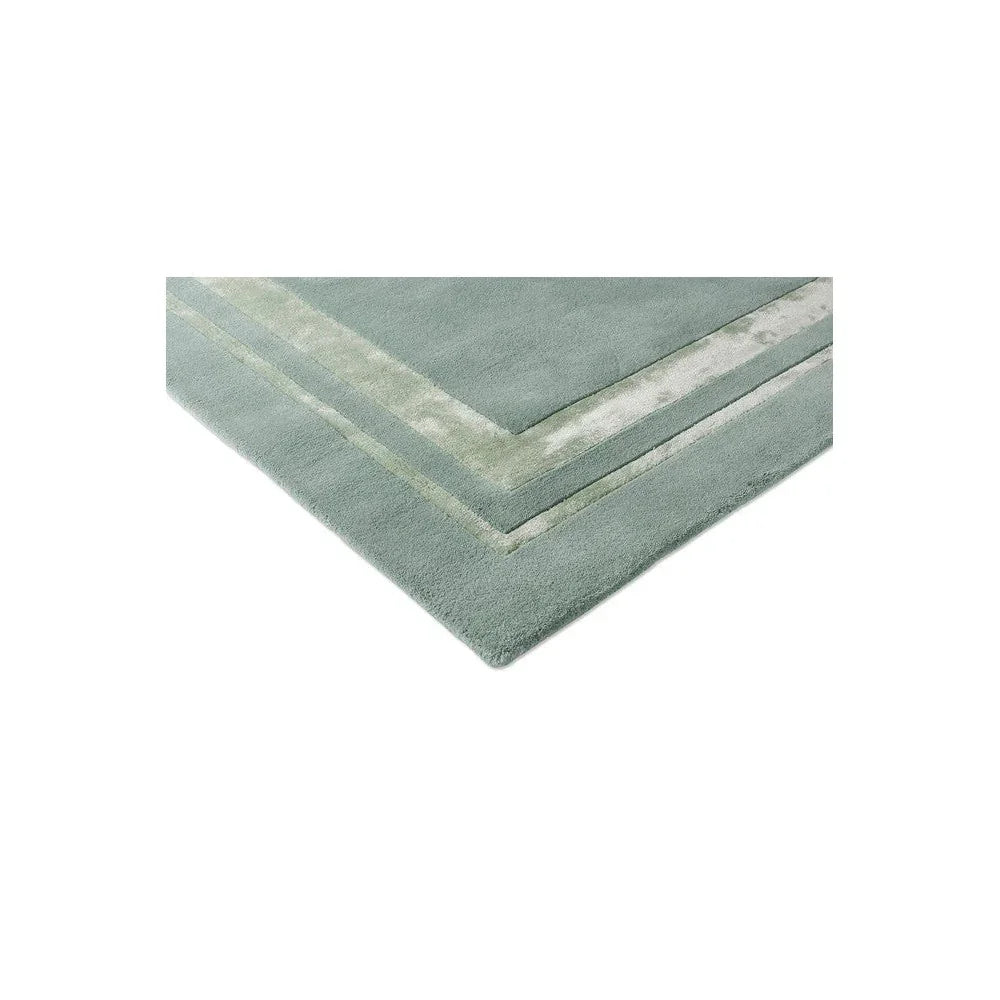Laura Ashley Redbrook Duck Egg Rug featuring stacked border pattern in duck egg, sage and cream on pale background, hand-tufted wool