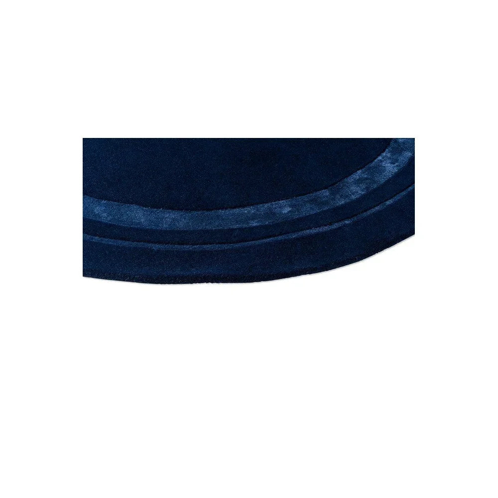 Laura Ashley Redbrook Midnight Designer Round Rug featuring solid navy blue with lighter blue piping on white background, machine-made wool