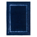 Laura Ashley Redbrook Midnight rug featuring geometric border in navy and light blue on deep navy field, hand-tufted wool