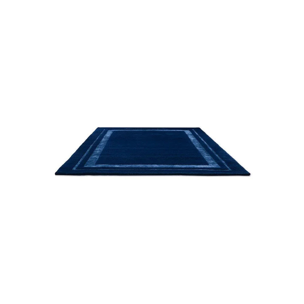 Laura Ashley Redbrook Midnight Designer Rug featuring geometric border in navy blue, royal blue and steel on midnight blue background, hand-tufted wool