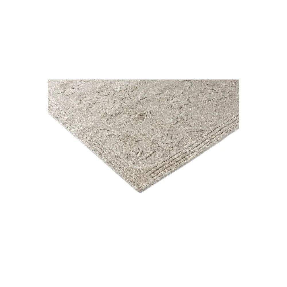 Laura Ashley Rye Natural Designer Rug featuring floral embossed pattern in cream, beige and ivory on natural background, hand-tufted wool