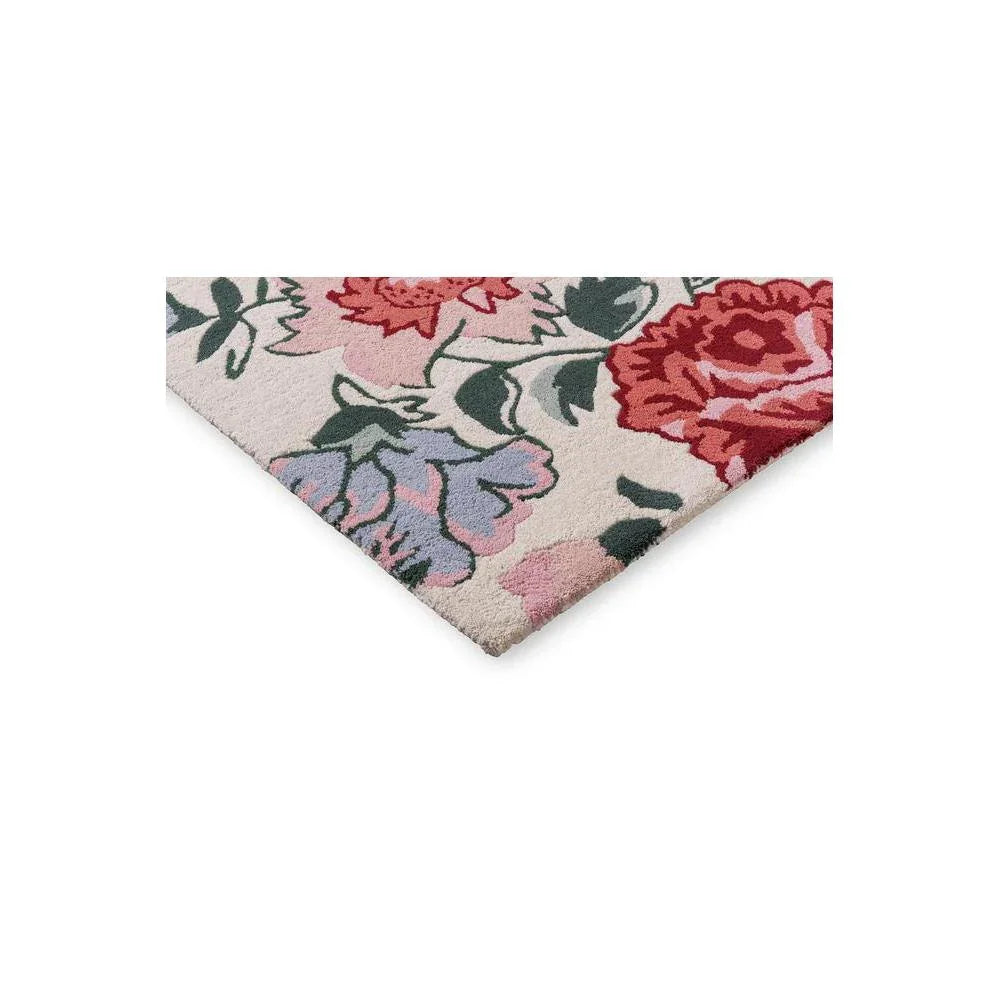Laura Ashley Wendling Floral Rug featuring floral pattern in red, pink, lavender and sage green on cream background, hand-tufted wool