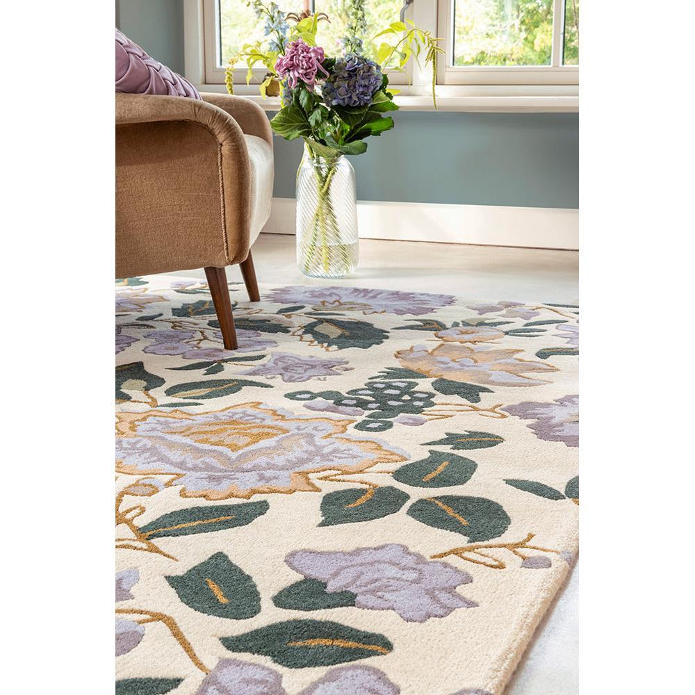 Laura Ashley Wendling Floral rug featuring botanical pattern in heather purple, lilac, sage green on cream background, hand-tufted wool