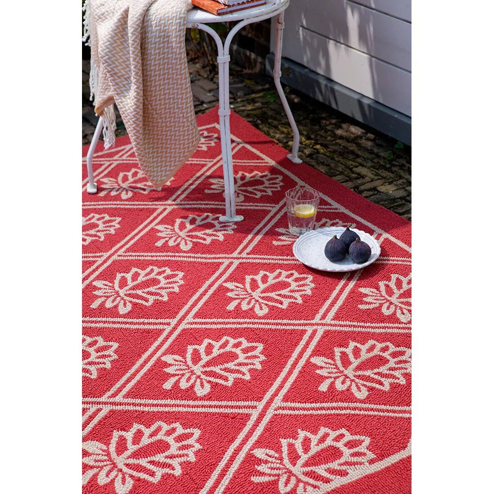 Laura Ashley Porchester Poppy Red outdoor rug featuring white leafy floral grid pattern in red on outdoor-friendly polypropylene, machine-woven