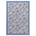 Laura Ashley Thorncliff Sky Blue Outdoor Rug featuring blue-petal daisies with red centers on beige, sky-blue border, machine-woven polypropylene