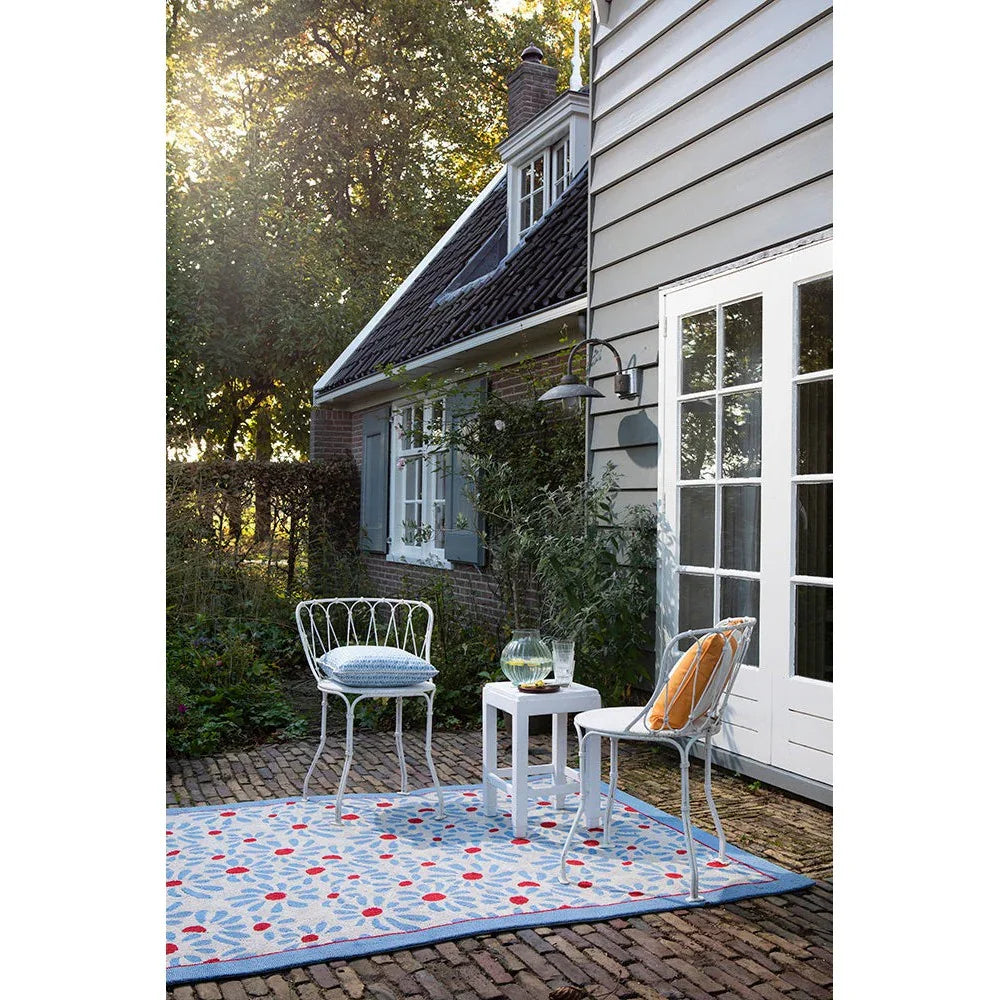 Laura Ashley Thorncliff Sky Blue Outdoor Designer Rug featuring floral geometric pattern in sky blue, navy, white and red on pale blue background, machine-woven polypropylene