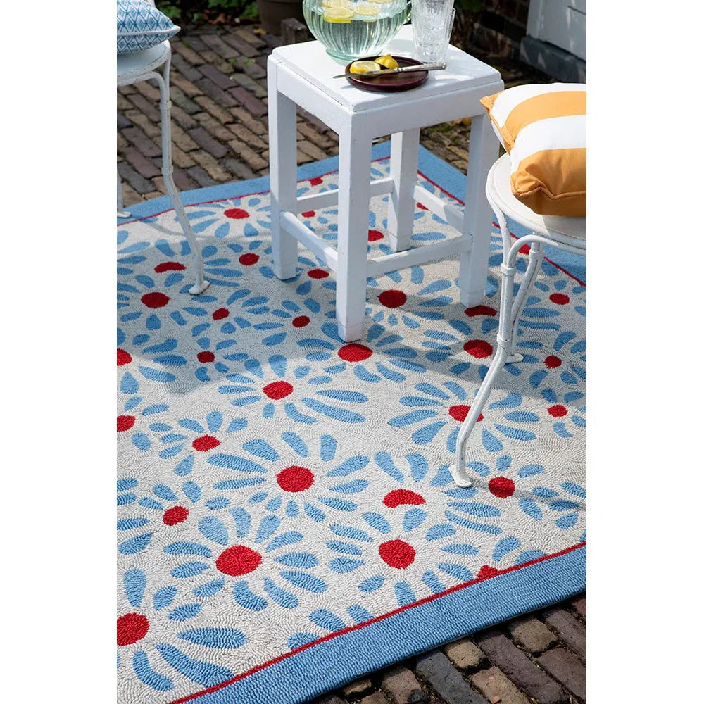 Laura Ashley Thorncliff Outdoor Rug featuring floral petal pattern in sky blue and red on white with blue border, machine-woven polypropylene