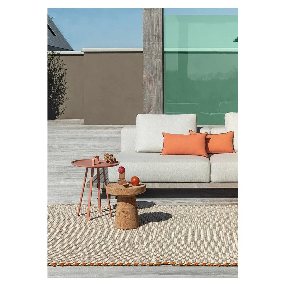 Brink & Campman Lace Tri-colour White Outdoor Rug featuring woven stripe in cream with orange trim on light grey deck, machine-made polypropylene