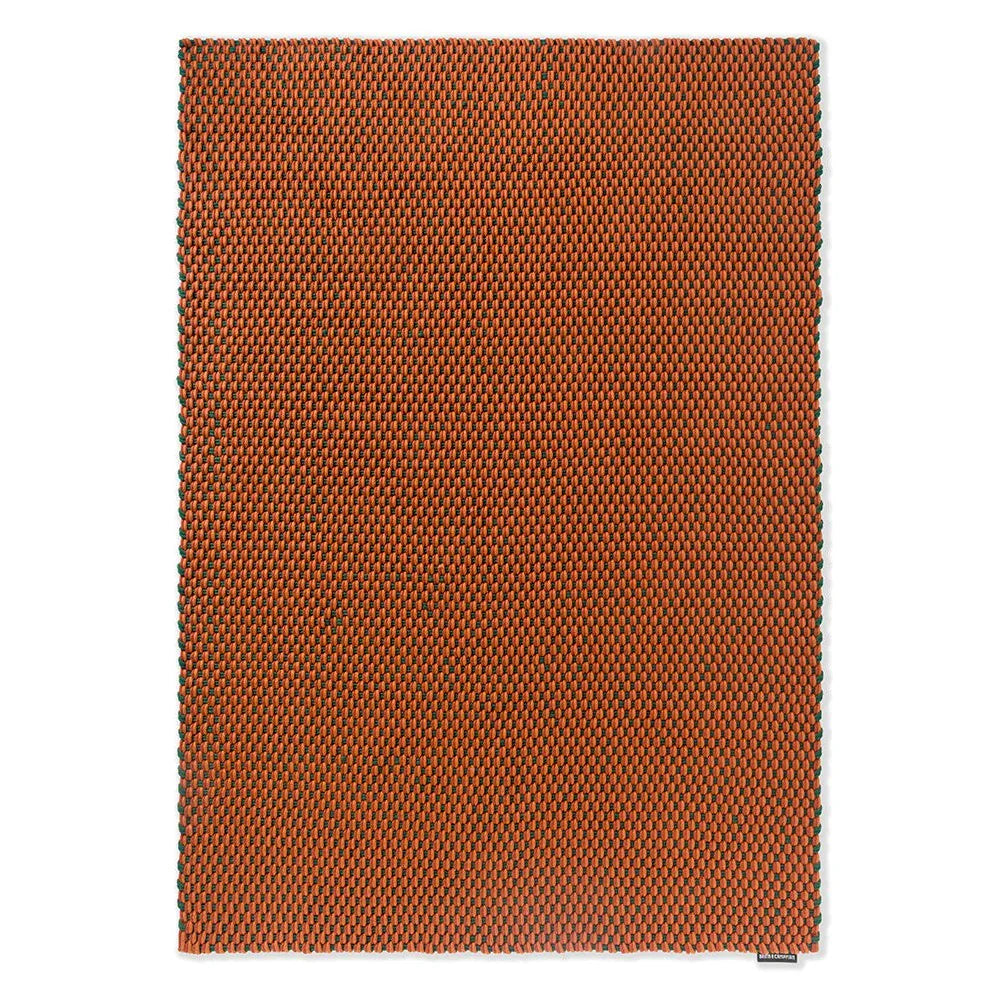 Brink & Campman Lace Tri-colour Terra outdoor rug featuring textured flatwoven pattern in terracotta orange with green accents on cream background, polypropylene