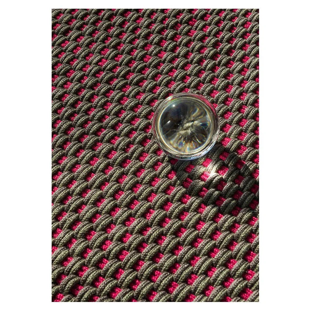 Brink & Campman Lace Tri-coloure Thy Outdoor Designer Rug featuring lace-like woven pattern in charcoal gray, pink magenta and black on dark background, power-loomed polypropylene