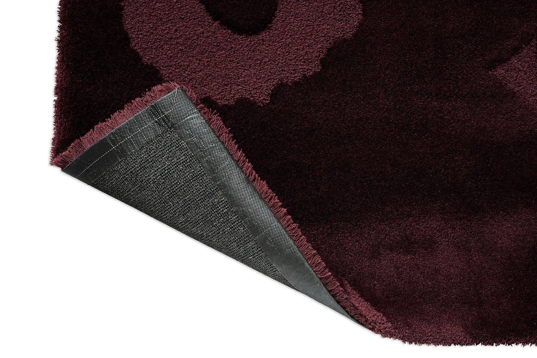 Marimekko Unikko Burgundy Rug featuring floral pattern in burgundy maroon and wine red on white background, tufted wool