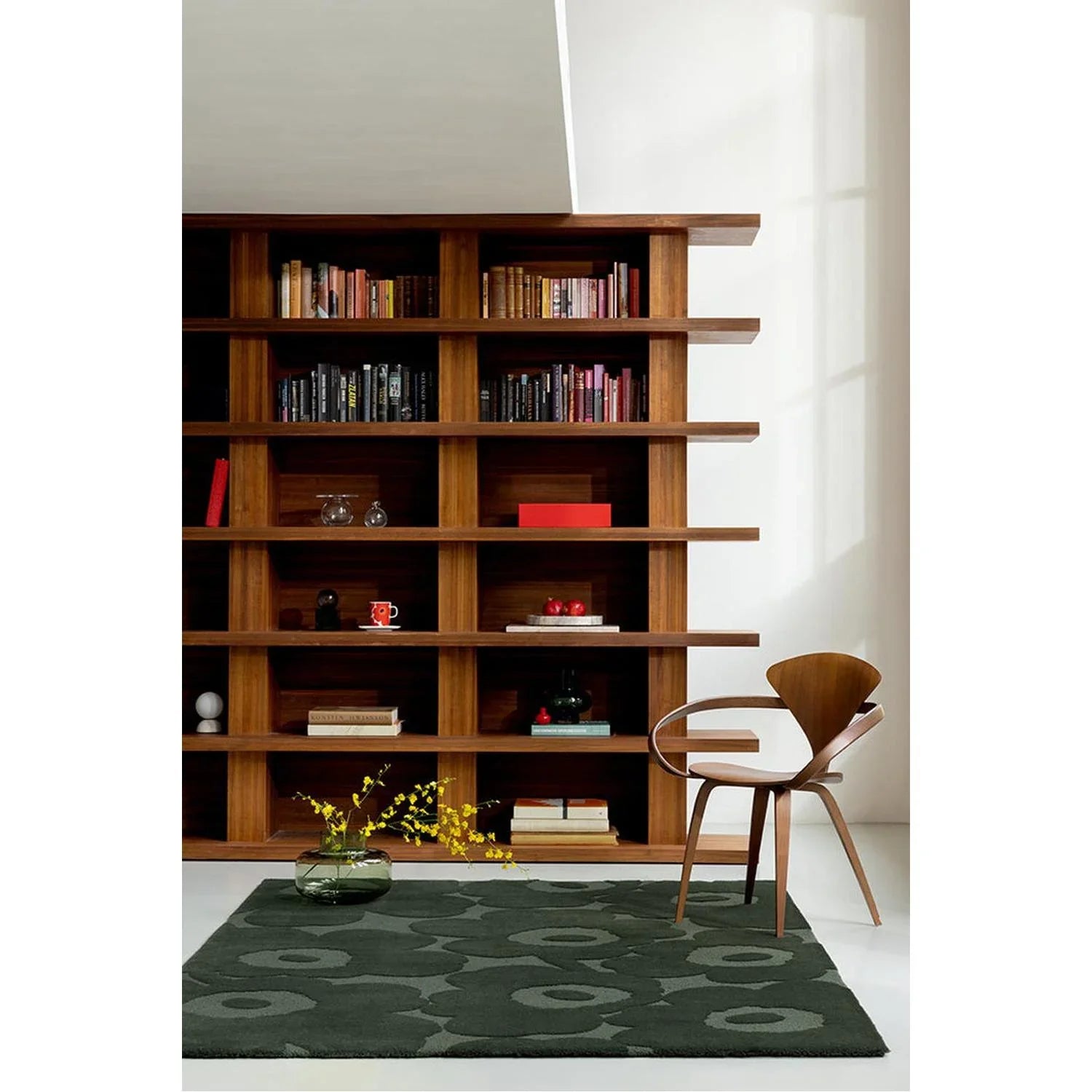 Marimekko Unikko Dark Green rug featuring circular motif in dark green, olive and sage on deep green background; hand-tufted wool